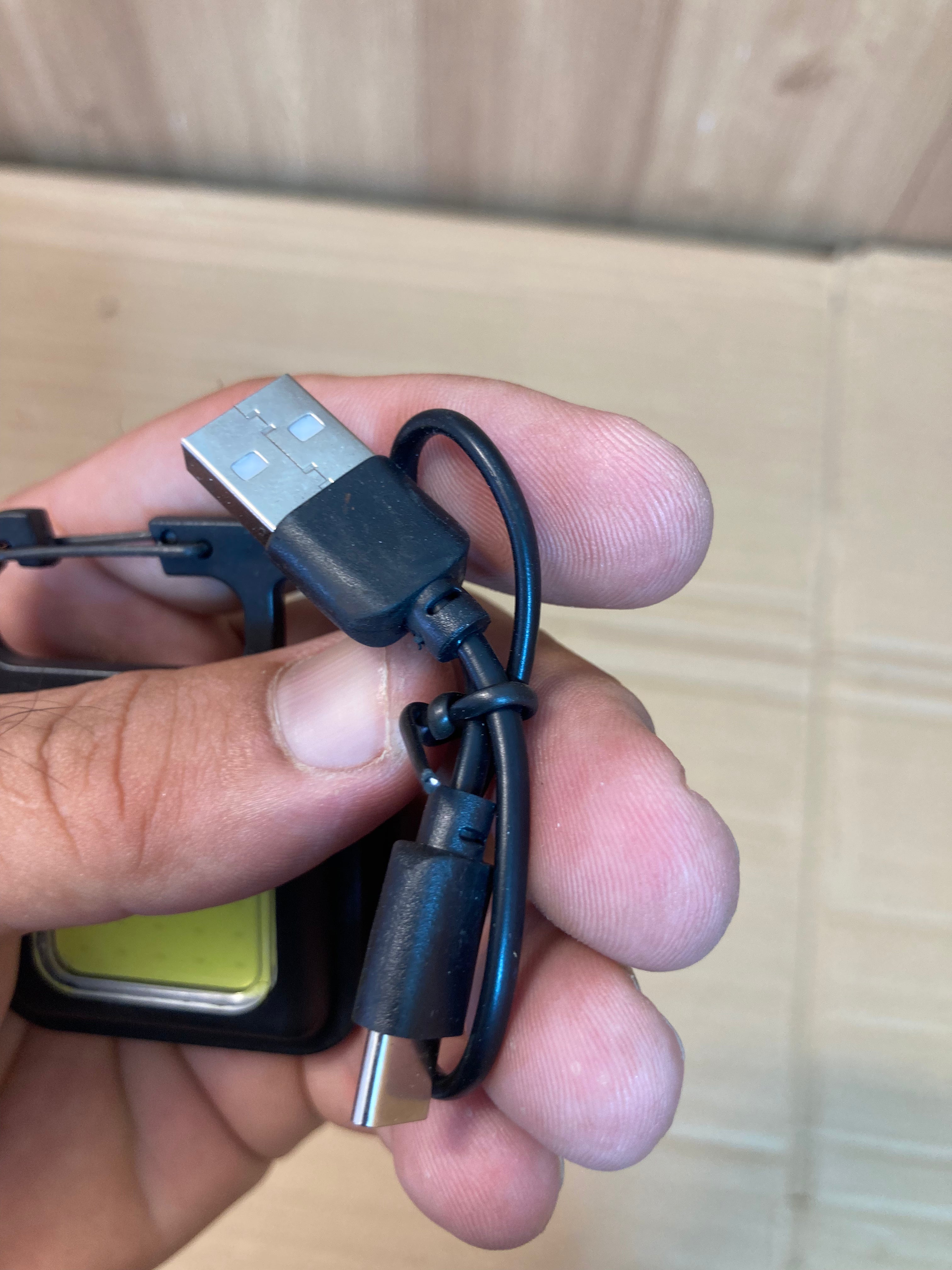 Compact and Powerful: COB Rechargeable Keychain Light.