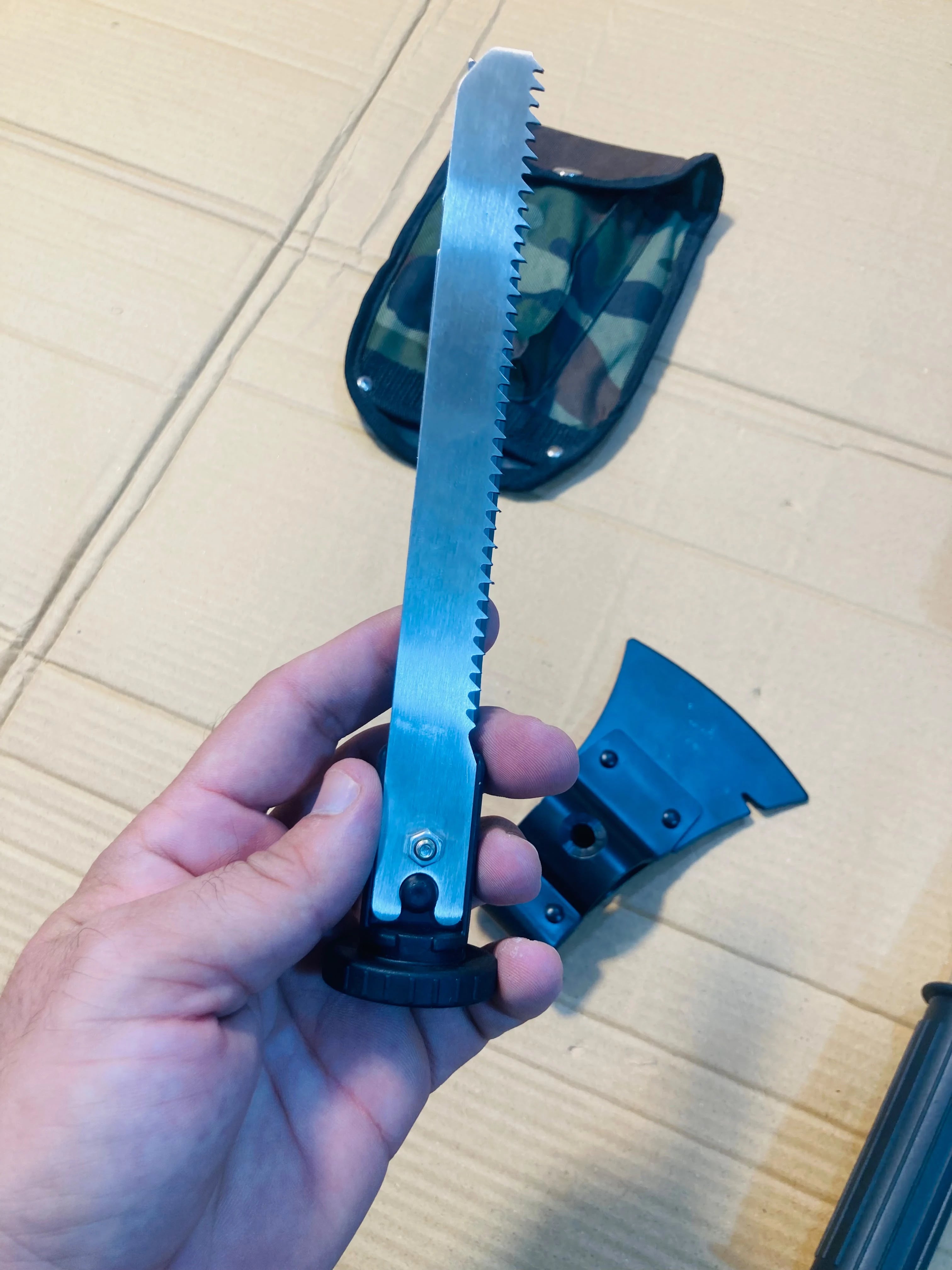 4-in-1 Multi-Tool Outdoor Camping Shovel, Axe, Saw, and Knife Set with Camouflage Carrying Pouch